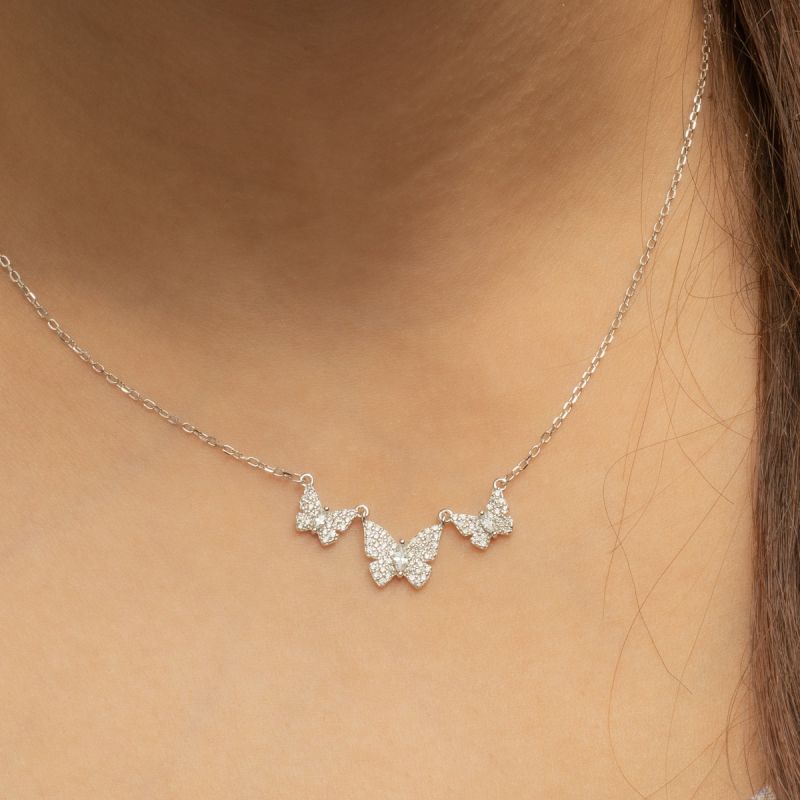 Butterfly spark trio necklace made of 925 sterling silver with three butterfly charms and zircon sparkle