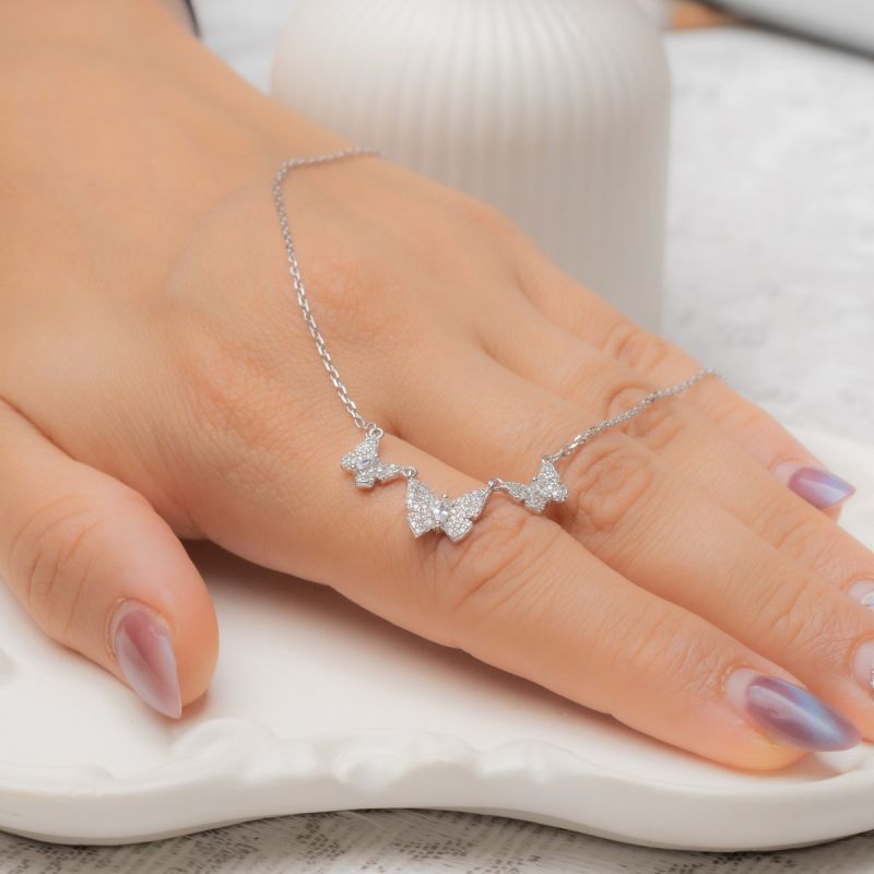 Butterfly spark trio necklace made of 925 sterling silver with three butterfly charms and zircon sparkle